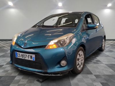 a picture of a blue toyota yaris parked on a checkered floor