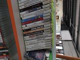 a lot of dvds on the shelf in the room