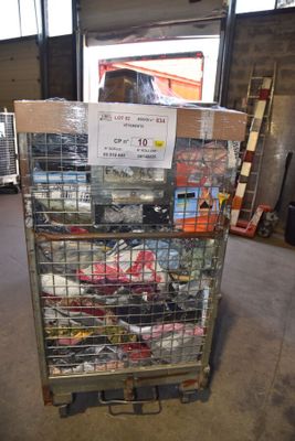 a cart with a lot of items in it in a warehouse