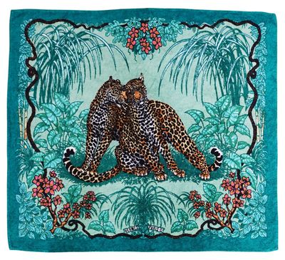 the leopard is sitting on the ground in the jungle