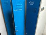 two blue lockers next to each other in a room