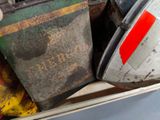 a metal container filled with old and rusty items