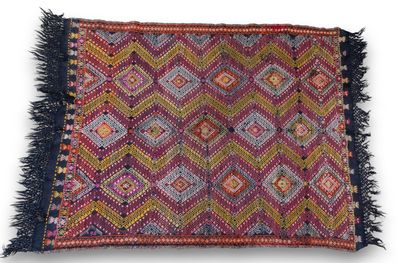 a multicolored rug with fringes on a white background