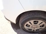 a white car that has a flat tire on it