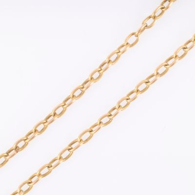 a close up of a gold chain on a white background