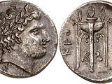 a silver coin with an image of a man holding a sword