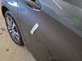a car with a sticker on the side of it ' s door