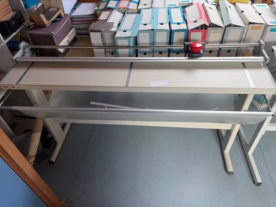 a lot of books on a table in a room