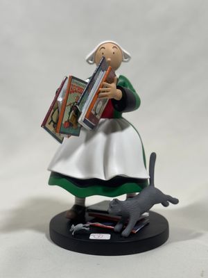 figurine of a woman with a book and a cat
