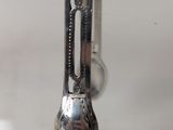 a spoon and a fork hanging from a hook