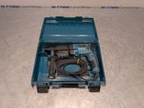 a blue box with a drill and a cord in it