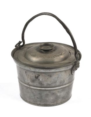 an old metal bucket with a handle on a white background