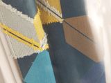 a close up of a tie hanging on a window
