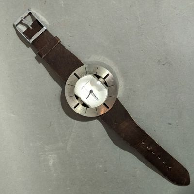 a watch that is laying on a table