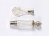 pair of glass salt and pepper shakers on a white surface