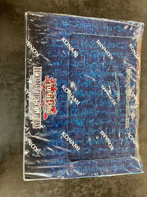a close up of a package of blue candy wrappers on a table