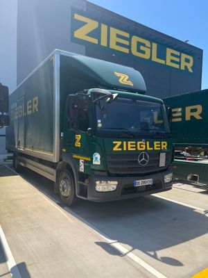 a large truck that is parked in front of a building