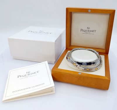 PEQUIGNET - Lot de deux bracelets d'homme en acier et plaqué…
