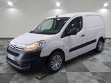 the white van is parked in a room with a checkered floor
