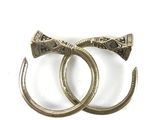 two rings with a bow on them on a white surface
