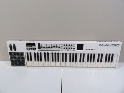 a close up of a keyboard on a table with a white background