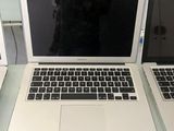 two laptops that are sitting on a table