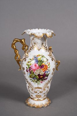 pair of antique porcelain vases decorated with flowers on a gray background