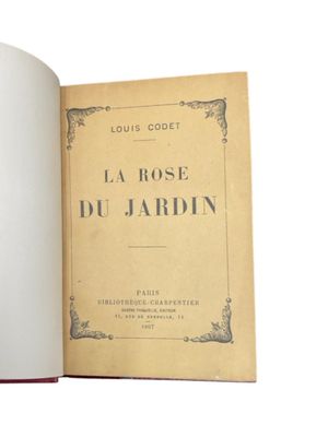 an open book with a picture of a rose on it