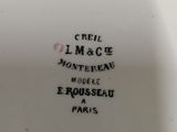 the bottom of a white plate with black writing on it