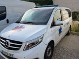 a white van that is parked next to a white van