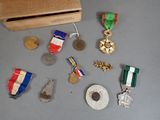 a box of medals and other items on the table