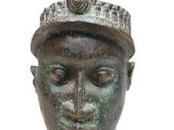 a statue of a man with a hat on it ' s head