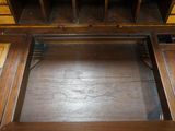 a wooden desk with two drawers and a drawer underneath it