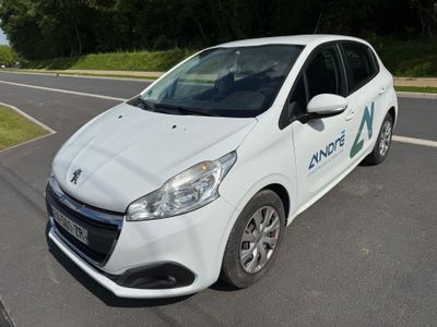a white car that is parked on the side of the road