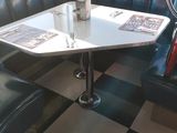 a booth with a checkered floor and black and white checkered flooring