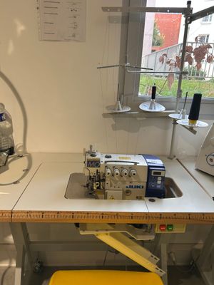 a sewing machine sitting on a table in a room