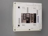 a close up of a white electronic device on a table