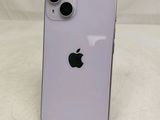 an apple iphone is sitting on a stand on a white surface