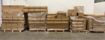 boxes and pallets are stacked on pallets in a warehouse