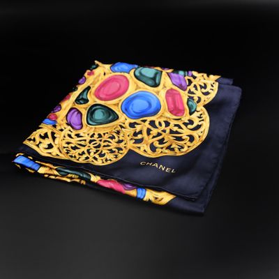 a close up of a pocket square with a colorful skull on it