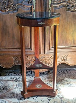 a wooden table with a glass top on a rug
