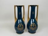 pair of blue and gold vases on a white background