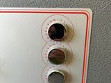 a close up of a control panel on a wall