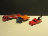 three toy trucks that are sitting next to each other