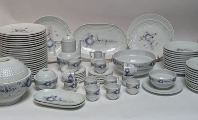 a lot of plates and bowls that are sitting on a table