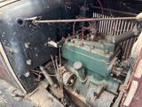an old car engine that is sitting in the back of the truck