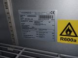 a picture of a caution sign on the back of a machine