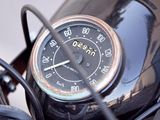 a close up of a motorcycle with a speedometer on it ' s handlebar
