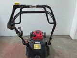 an image of a lawn mower in a garage