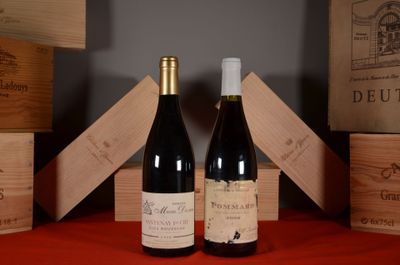 two bottles of wine sitting next to each other on a table
